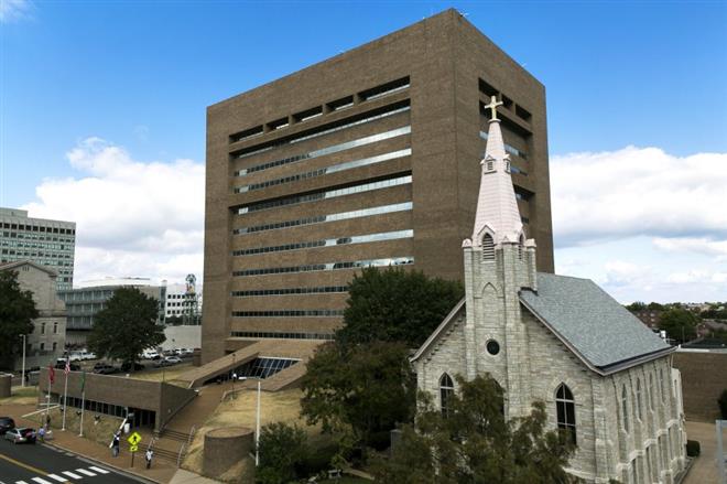 201 Poplar Avenue with Trinity Lutheran Church in foreground
